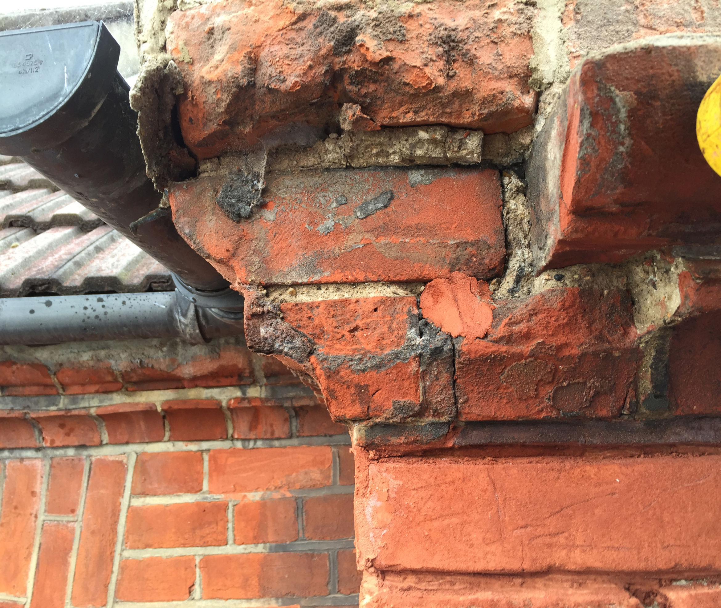 Damaged brick face